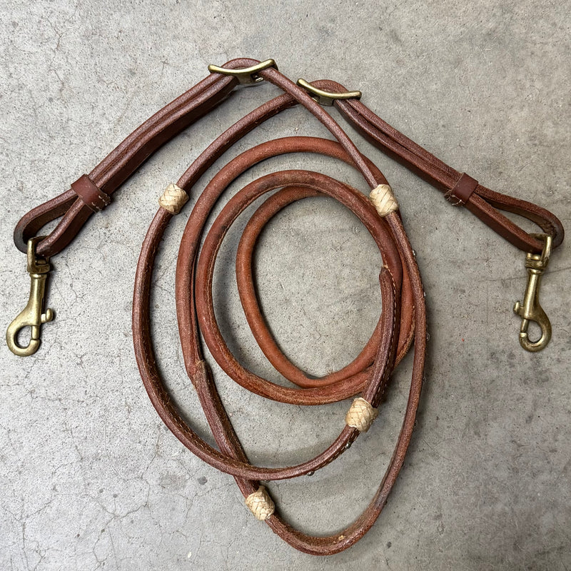 Load image into Gallery viewer, Used Rawhide &amp; Dots Round Sewn Barrel Rein w/ Snap Ends
